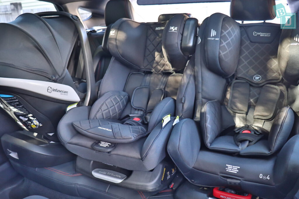 2024 Ford Mustang Mach-E Premium with three child seats installed in the second row
