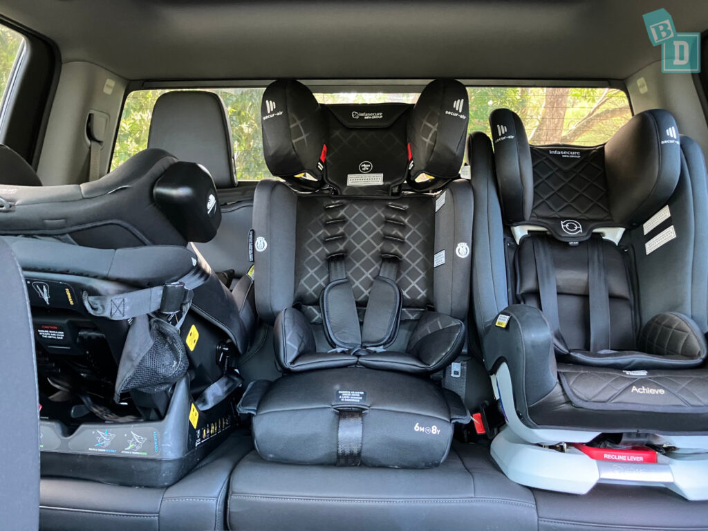 2024 Chevrolet Silverado 1500 LTZ Premium with three child seats installed in the second row
