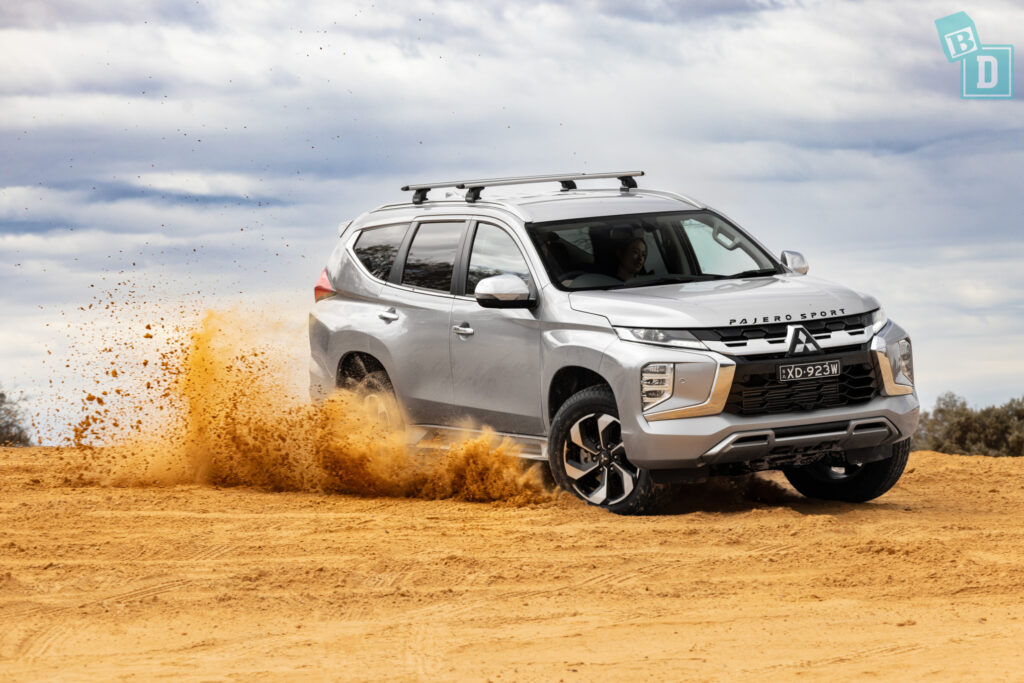 2025 Mitsubishi Pajero Sport driving on sand