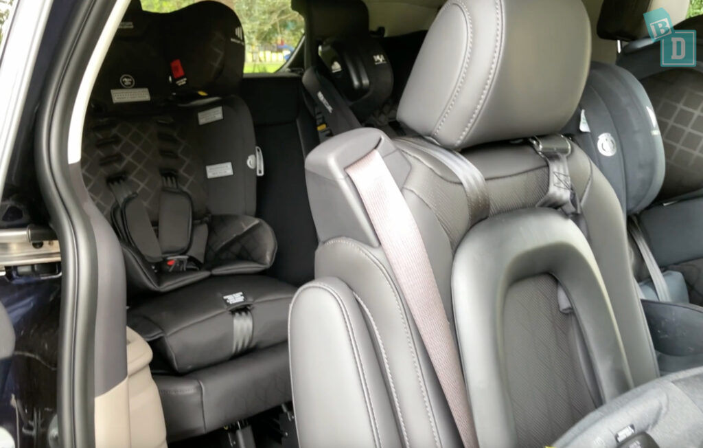 2025 Kia Carnival GT-Line Hybrid access to the third row with child seats installed in the second row 