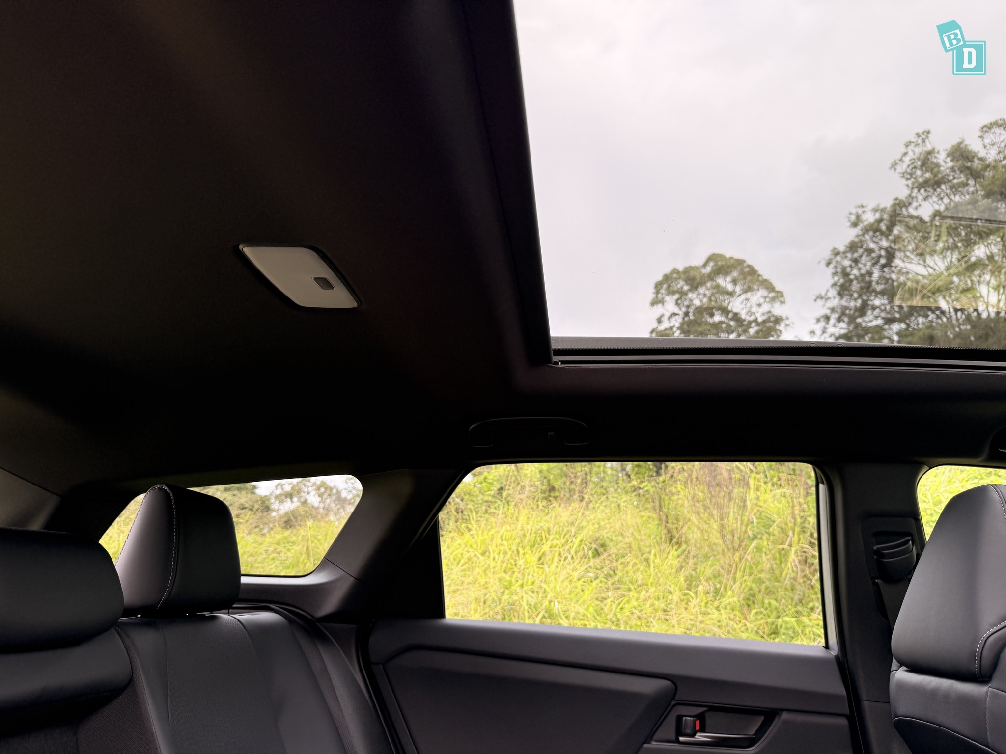 2026 Toyota bZ4X Touring panoramic sunroof viewed from second row with sunshade open